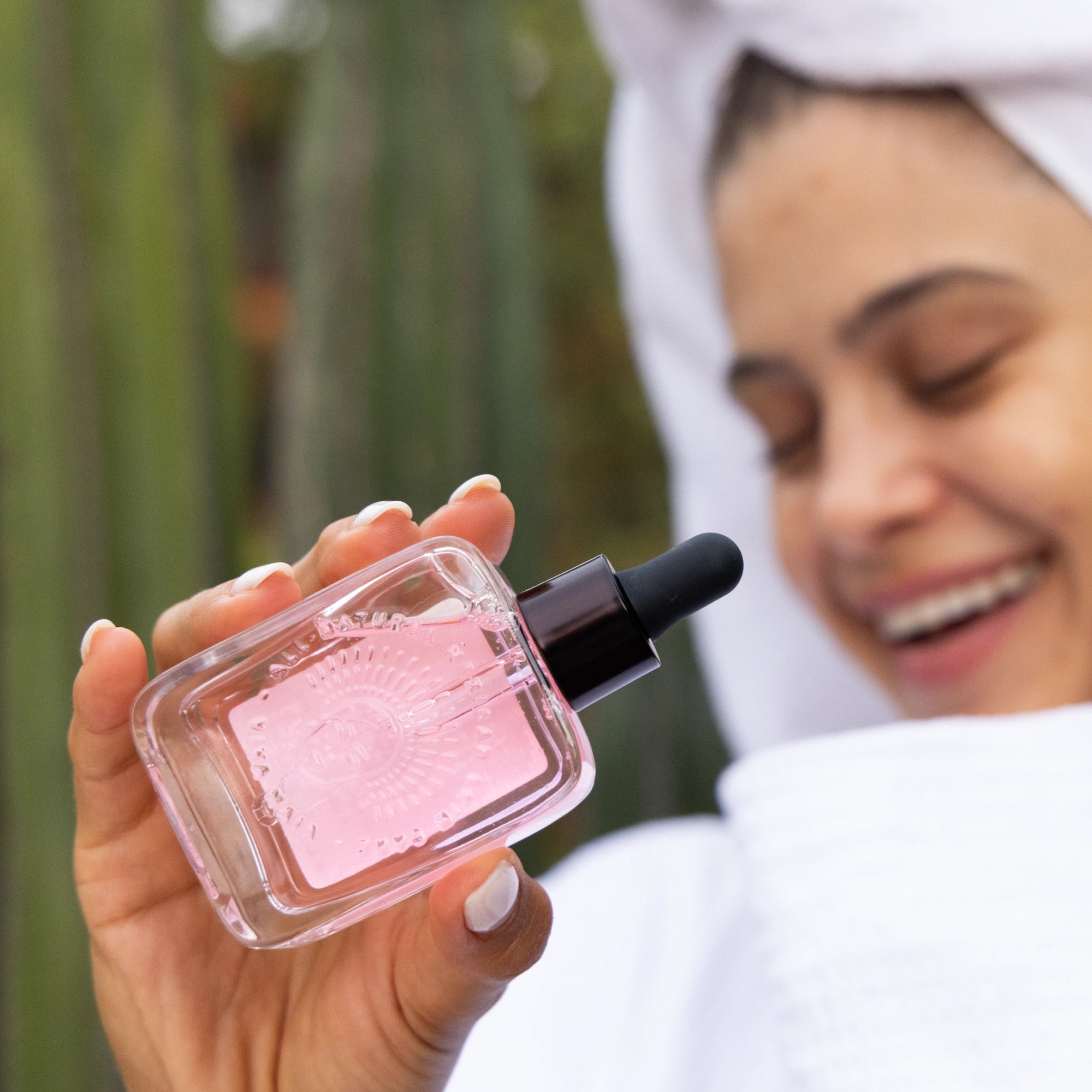 Mexican girl model with bottle of Regenerating Serum